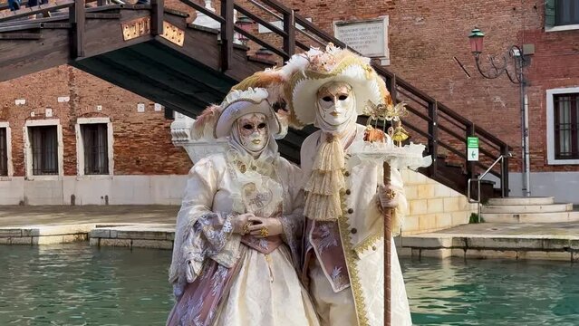 Venice Carnival. People in Venetian carnival masks and costumes on streets of Venice, Italy, Europe February 10, 2024. High quality 4k footage