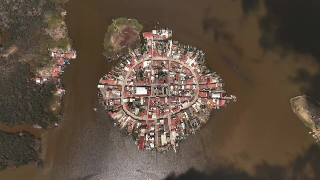 Cloud shadows moving over the Mexcaltitan town in Mexico - Birds eye, drone shot