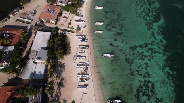 Aerial Top Down View Of Beach, tilt up reveal Los Roques Airport, coastline caribbean island