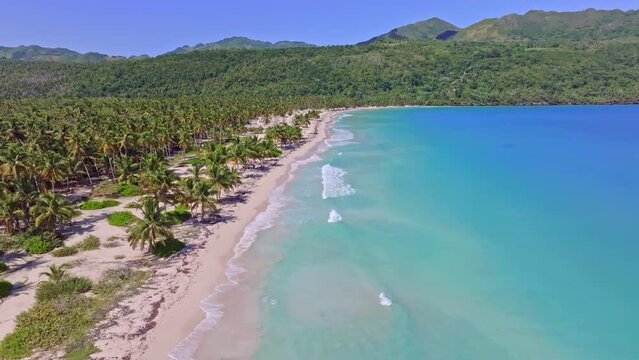 Empty coastline with white sand beach, turquoise water, drone in the Caribbean