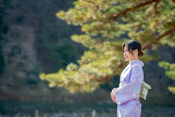 Travel, muslim travel, Arashiyama, Asian female tourist in traditional Japanese kimonos walking and travel to Tenryu-ji temple and Arashiyama city, Kyoto, Arashiyama, Japan.