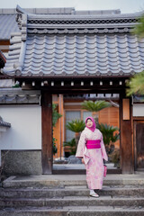 Travel, muslim travel, Arashiyama, Asian female Muslim tourist in traditional japanese kimonos walking and travel to Tenryu-ji temple and Arashiyama city, Kyoto, Arashiyama, Japan.