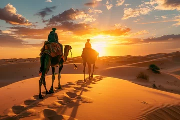Fotobehang Berber man leading camel caravan at sunset. A man leads two camels through the desert © Kien