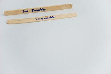 handwriting messages on ice cream sticks in close-up as a concept for building self-esteem
