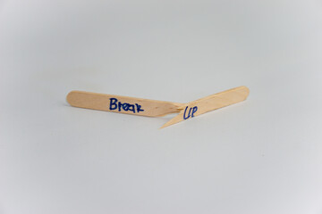 handwriting messages on ice cream sticks in close-up as a concept for building self-esteem