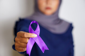 International Epilepsy Day. an Asian woman holds a purple ribbon. Alzheimer's Disease, Pancreatic...