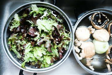 lettuce and shiitake mushroom or cleaning vegetble for cook or washing vegetable