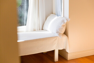 Fototapeta na wymiar Minimalist Home Window Seat for Tranquil Relaxation
