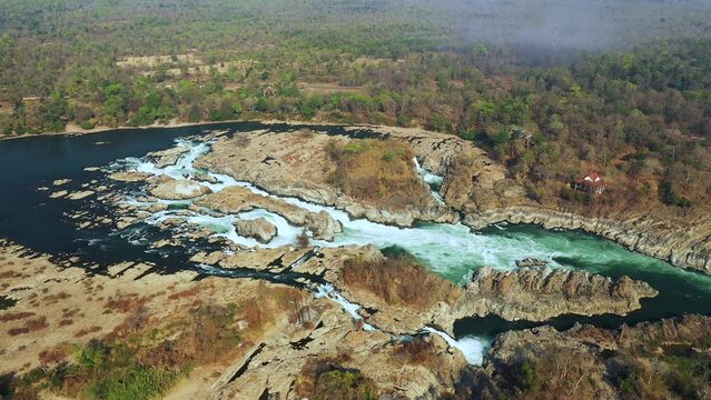 The Khone Falls of the Mekong and its arid vegetation in Asia, Laos, Champassak, the 4000 islands, Don Det, on a sunny day.