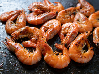 Grilled Shrimp on a Dark Surface