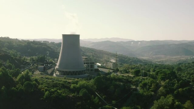 Enel Geothermal Green Renewable Sustainable Power Plant Cooling Towers Landscape in Larderello, Tuscany, Italy, drone aerial view