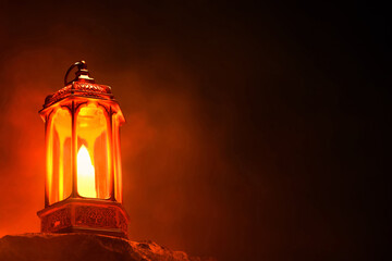Shiny arabic lantern on top rock mountain at dark night sky, Ramadan kareem background - 739692118