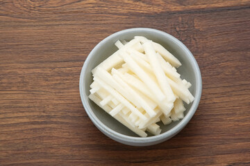 A bowl of fresh jicama or bengkoang (Jicama slices), gut health.
