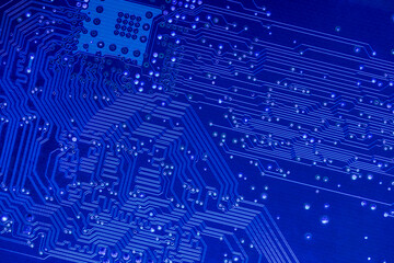 blue printed motherboard. computer electronic circuit board. closeup view.