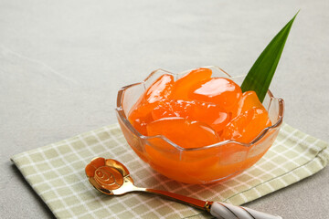 Manisan Kolang-Kaling, or preserved sugar palm fruit with orange color, Indonesian drink and dessert during the month of Ramadan. Selected focus.
