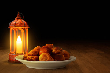 Shiny arabic lantern and bowl of fresh dried dates on wooden floor at night, Ramadan kareem background - 739695541