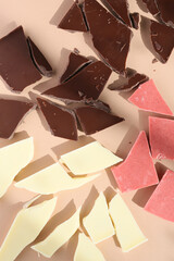 different types of chocolates on a colorful background 