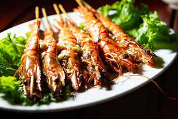 Grilled shrimp skewers on a plate	