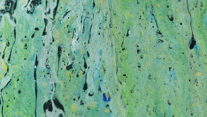 Abstract background. Liquid mix. Colorful acrylic art. Green blue yellow black glitter texture ink...