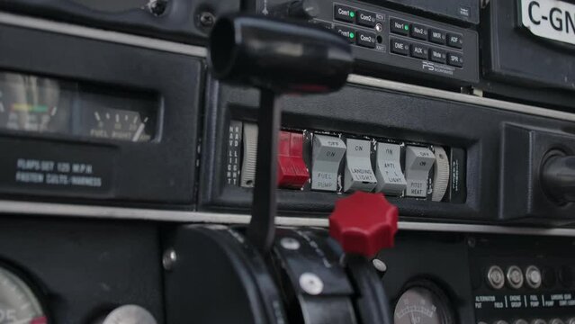 Switches, Buttons and Levers in an Airplane Cockpit Close Up