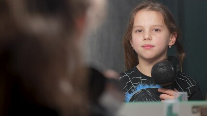 The girl dries her hair with a hairdryer, close-up