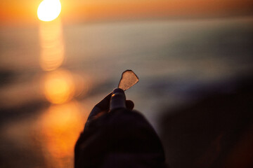 sunset at the beach with 
sea ​​glass