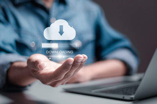 Download processing data concept. Downloading data from cloud storage. Person using laptop with downloading bar on virtual screen for download files.