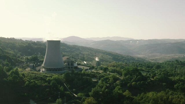 Enel Geothermal Green Renewable Sustainable Power Plant Cooling Towers Landscape in Larderello, Tuscany, Italy, drone aerial view