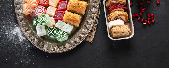 Traditional turkish coffee and turkish delight on dark  background.