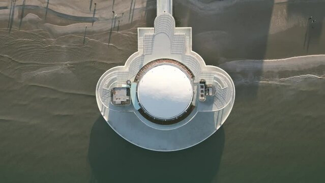 A drone shot over a structure over the sea in Senigallia - Italy