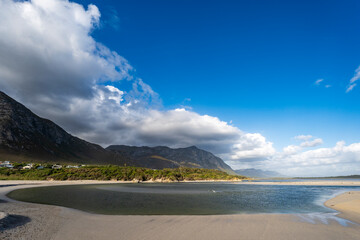 The beautiful Kleinrivier (or Klein River) Estuary at Grotto Beach with clouds hanging over the Kleinrivier Mountains. Hermanus, Whale Coast, Overberg, Western Cape, South Africa.