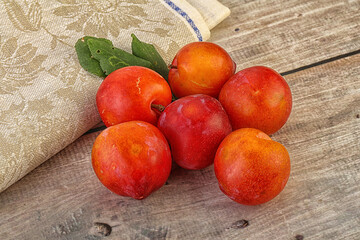 Red juicy raw plum heap