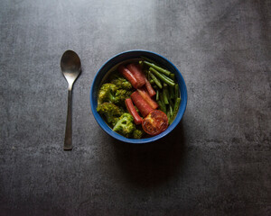 Healthy food ingredient saute vegetables served in a bowl. Top view