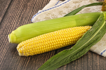 Yellow sweet raw cob corn