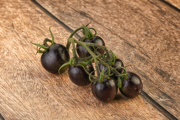 Ripe tasty black cherry tomato