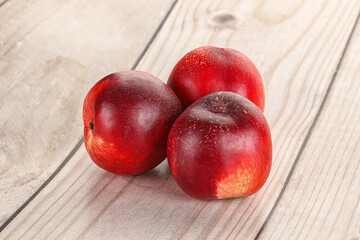 Ripe sweet juicy nectarines heap