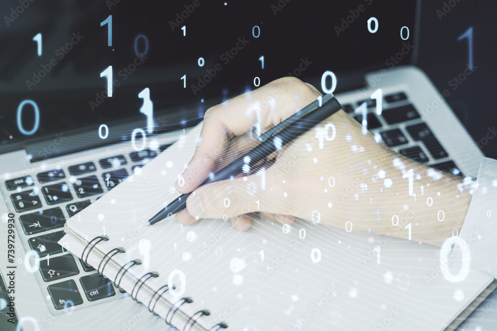 Leinwandbilder creative concept of binary code illustration and hand writing in notebook on background with laptop.