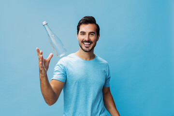 Man sport smile lifestyle healthy t-shirt studio water attractive happy drink bottle