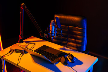 Home studio podcast interior. Microphone, table and chair