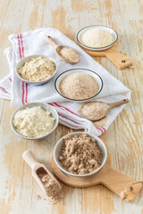 Fototapeta na wymiar Assortment of various gluten free flour, without carbohydrate (almond and coconut flour, psyllium husk powder, rough-ground flaxseed flour)