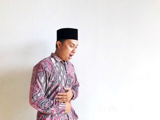 A Muslim man has a stomach ache