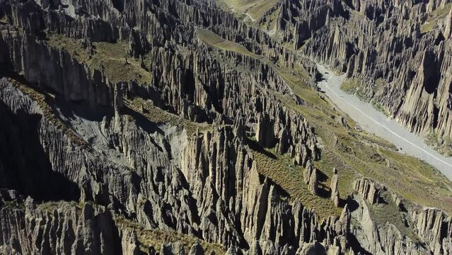 Flyover dramatic geology, valley of rocks, eroded spires in Bolivia