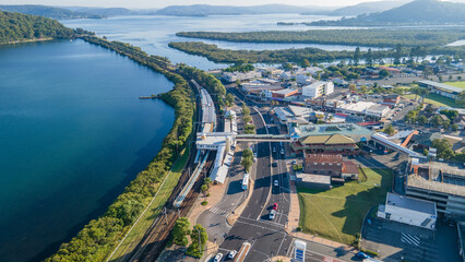 Aerial drone view of Woy Woy on the Central Coast of New South Wales, Australia showing the road and rail bridges in the background 