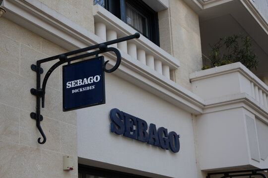 Sebago docksides Usa brand logo and text sign store chain of american clothing footwear facade shop shoes