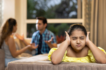 Child listening to their parents fighting