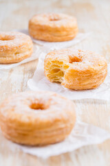 Obraz na płótnie Canvas Cronuts - delicious fusion of croissant and donut with raspberry jam.