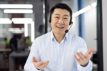 Webcam view, Asian support worker in shirt with headset smiling and looking at camera, businessman...