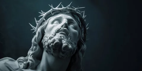  Sculpture of Jesus Christ wearing a crown of thorns. Face, head close-up on a dark background. © Honey Bear