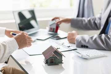 Real estate brokers are offering sample homes for customers choose from and recommending estate insurance promotions help protect their properties. Concept of offering real estate and home insurance