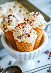 Vanilla Ice Cream Scoops with Chocolate Shavings in Waffle Cones